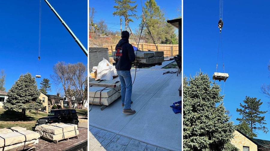 Crane Hoisting Giant Stones For Backyard Hardscaping Project