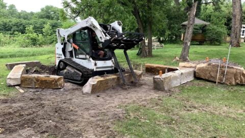 Michalski Employee Moving Large Stones