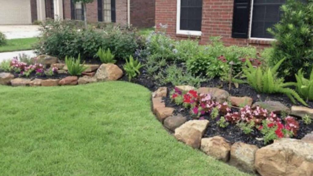 Rock Edging Mixed With Plants Flowers And Mulch